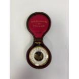 Brass-cased open-faced German skeleton pocket barometer,  the white dial named V.REG VERAND BETG,