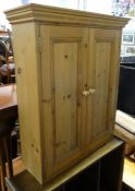 Pine two-door cupboard, a 20th century oak sewing table and a small 20th century open bookcase (3)