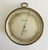 Early 20th century brass cased compensated barometer by T. Wheeler (London), the silvered dial