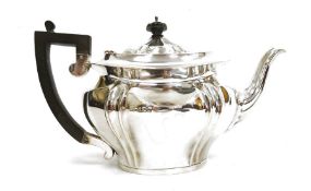 Silver teapot, oval and serpentine-shaped, Birmingham 1909, with ebonised handle, 18ozt approx.