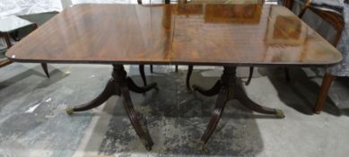 Reproduction Regency mahogany twin-pedestal dining table, the rectangular top with rounded corners