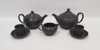 Group of 20th century Wedgwood black basalt teawares, impressed marks, comprising two teapots and