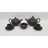 Group of 20th century Wedgwood black basalt teawares, impressed marks, comprising two teapots and