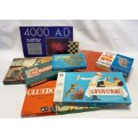 Two Boxes of vintage children's games and jigsaws to include Twister, Monopoly, Buccaneer, Go,