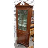 Modern mahogany corner display cabinet, the architectural pediment above astragal-glazed door, above