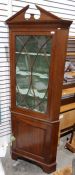 Modern mahogany corner display cabinet, the architectural pediment above astragal-glazed door, above