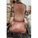 19th century armchair with pink upholstered seat, back and arm rest, overscrolled hand rests, on