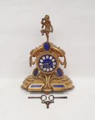 French gilt metal and ormolu mantel clock, HT monogram, with musical putto figure surmount, arched