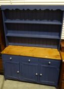 Blue-painted dresser with two shelves, a pine top above three drawers and cupboard doors