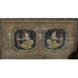 Eastern-style needlework panel with two figures bearing swords, set in gold-coloured threaded