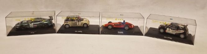 Four cased Scalextric slot cars to include Mini Cooper S Marked 17A, Mini Cooper S marked 1, Aston