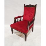 Late Victorian/Edwardian armchair with red upholstered seat, back and armrests, on turned and ringed