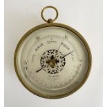 Late 19th/early 20th century brass cased Callaghan (London) barometer,  with pierced silvered dial