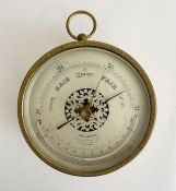 Late 19th/early 20th century brass cased Callaghan (London) barometer,  with pierced silvered dial