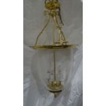 Reproduction Georgian-style hanging lantern of circular form, brass mounts with a glass shade and