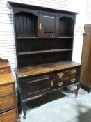 20th century oak dresser in the Georgian manner, the moulded cornice above cupboard door and open