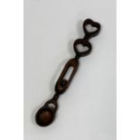 19th century Welsh love spoon, the handle containing a ball surmounted by two hearts Condition