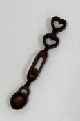 19th century Welsh love spoon, the handle containing a ball surmounted by two hearts Condition