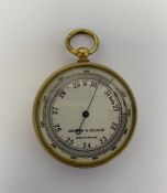 Edwardian gilt-metal pocket barometer by Griffin & George, with silvered dial, 4.7cm diam.