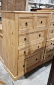 Modern pine chest of two short over three long drawers, to plinth base and two matching bedside
