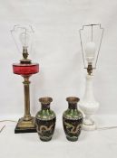 Fluted brass column oil lamp on stepped base with cranberry glass reservoir, converted to