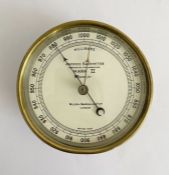 Early 20th century brass cased aneroid barometer by Wilson, Warden & Co. Ltd (London), the white