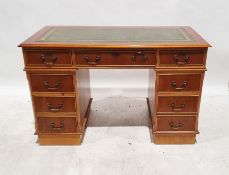 Modern yew pedestal desk with green leather inset top, nine assorted drawers, on plinth base, 78cm x