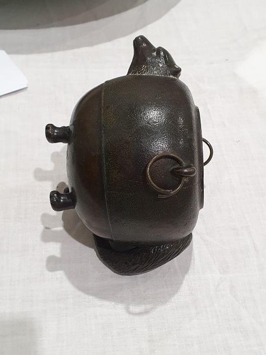 Japanese bronze 'Magic Tea Kettle' pot, ovoid, with a badger's head on one side and the tail on - Image 16 of 18