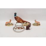 Beswick pottery model of a pheasant naturalistically modelled on rocky ground, 18cm wide, a Royal