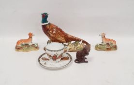 Beswick pottery model of a pheasant naturalistically modelled on rocky ground, 18cm wide, a Royal