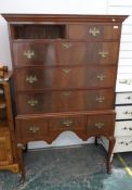 Reproduction mahogany chest on stand, the ogee moulded pediment with two short over three long