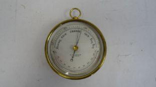 Pillischer barometer in brass case with temperature gauge, marked 'M Pillischer, London', 12cm