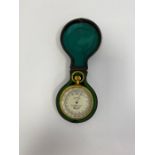 Brass -cased compensated pocket barometer by W Gregory & Co (London), the silvered dial numbered
