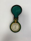 Brass -cased compensated pocket barometer by W Gregory & Co (London), the silvered dial numbered