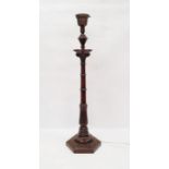 Carved wooden table lamp in the form of a pillar with acanthus leaf design, on a six-sided stepped