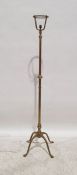 20th century brass standard lamp on quadruped base