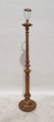 20th century standard lamp in gilt finish, the column moulded with leaves, wrythen carving, egg