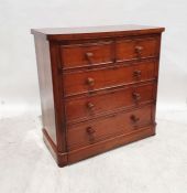 Victorian walnut chest of two short over three long drawers, the rectangular top with rounded