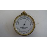 Negretti & Zambra of London pocket barometer with white enamel dial, 4.7cm diameter