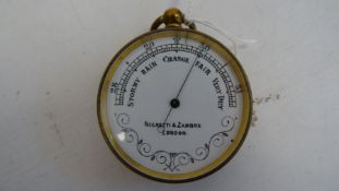 Negretti & Zambra of London pocket barometer with white enamel dial, 4.7cm diameter