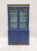 20th century painted cabinet, the leaded glazed doors enclosing shelves above two linenfold cupboard