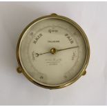 Victorian brass cased barometer produced by Callaghan of London, with silvered dial and three wall
