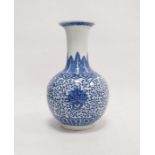 Contemporary Chinese bottle vase with underglaze blue decoration of lotus flowers on a scrolling