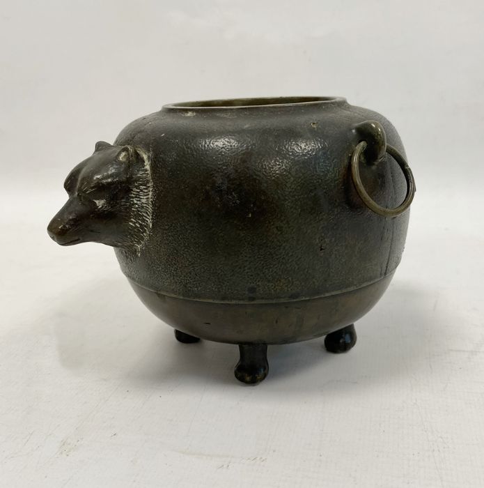 Japanese bronze 'Magic Tea Kettle' pot, ovoid, with a badger's head on one side and the tail on
