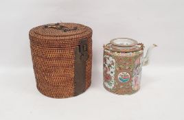 Cantonese porcelain cylindrical teapot and cover in a wicker basket, painted in the famille rose