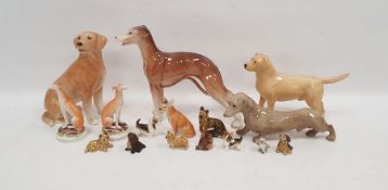 Collection of English pottery models of dogs, including a Melbaware labrador, a greyhound, a Beswick