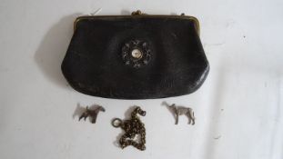 Small vintage handbag with a miniature clock inset to the interior showing the face on the outside