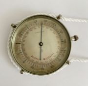 Early 20th century French (Paris) military white metal cased pocket barometer, the silvered dial