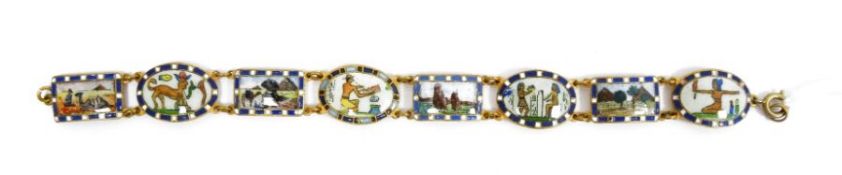 Egyptian theme enamel bracelet of eight variously shaped links, decorated sphinx, pyramids, etc