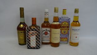 Six bottles of assorted spirits to include Cointreau (one litre), Gordon's Gin, Jim Beam, Hine